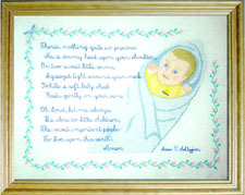 Interchangeable baby and prayer surrounded by baby rosebuds by Susan Saltzgiver Designs